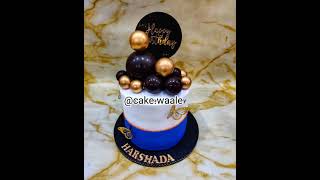 golden black ball cake