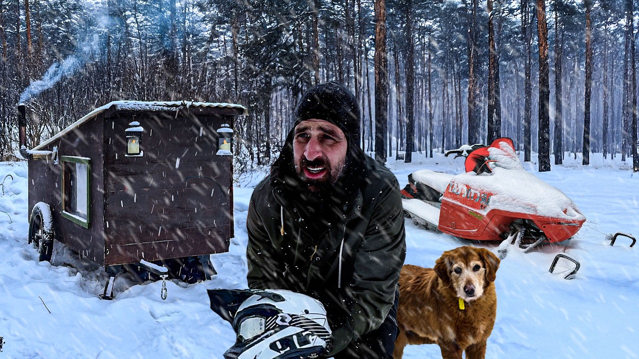 Escaping a WINTER STORM in our Snowmobile Cabin!
