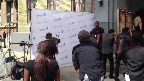 Celebrity pops out of step and repeat banner!