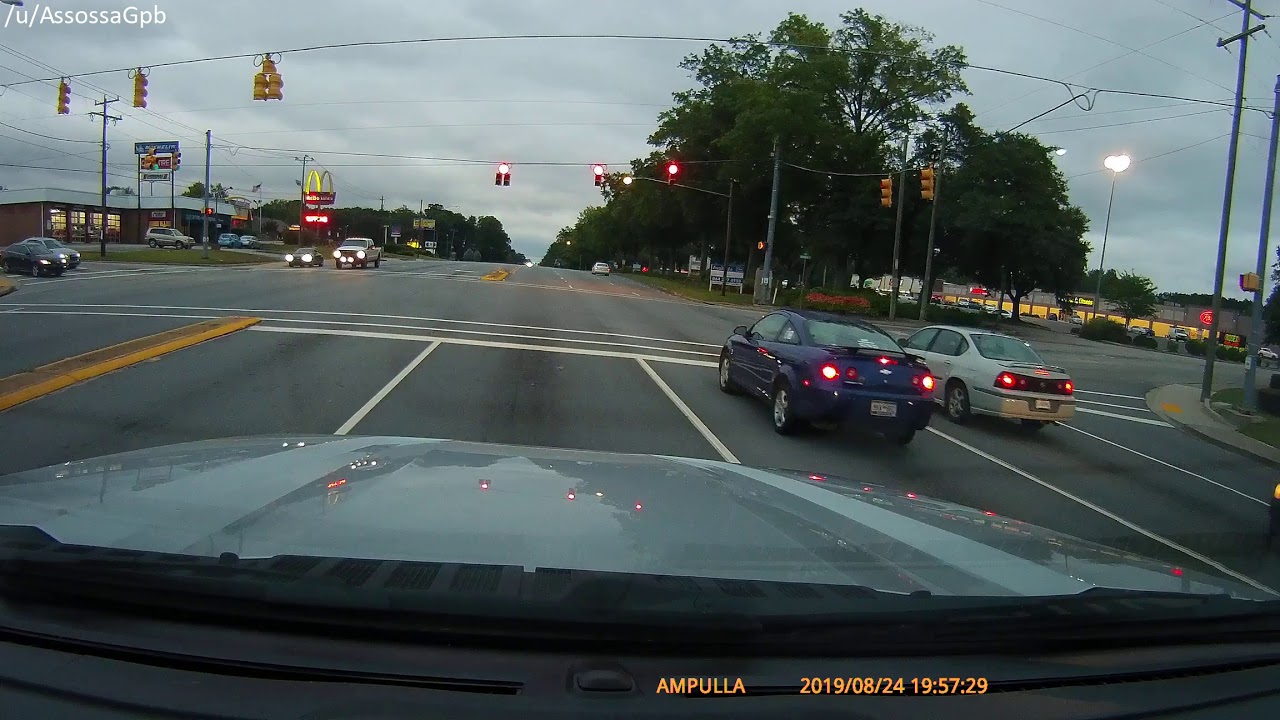 Motorcycle blows red light infront of cop YouTube