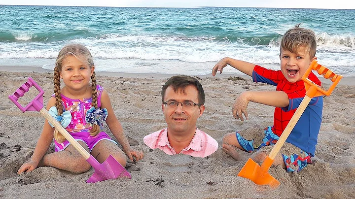 Diana and Roma play with Dad on the Beach