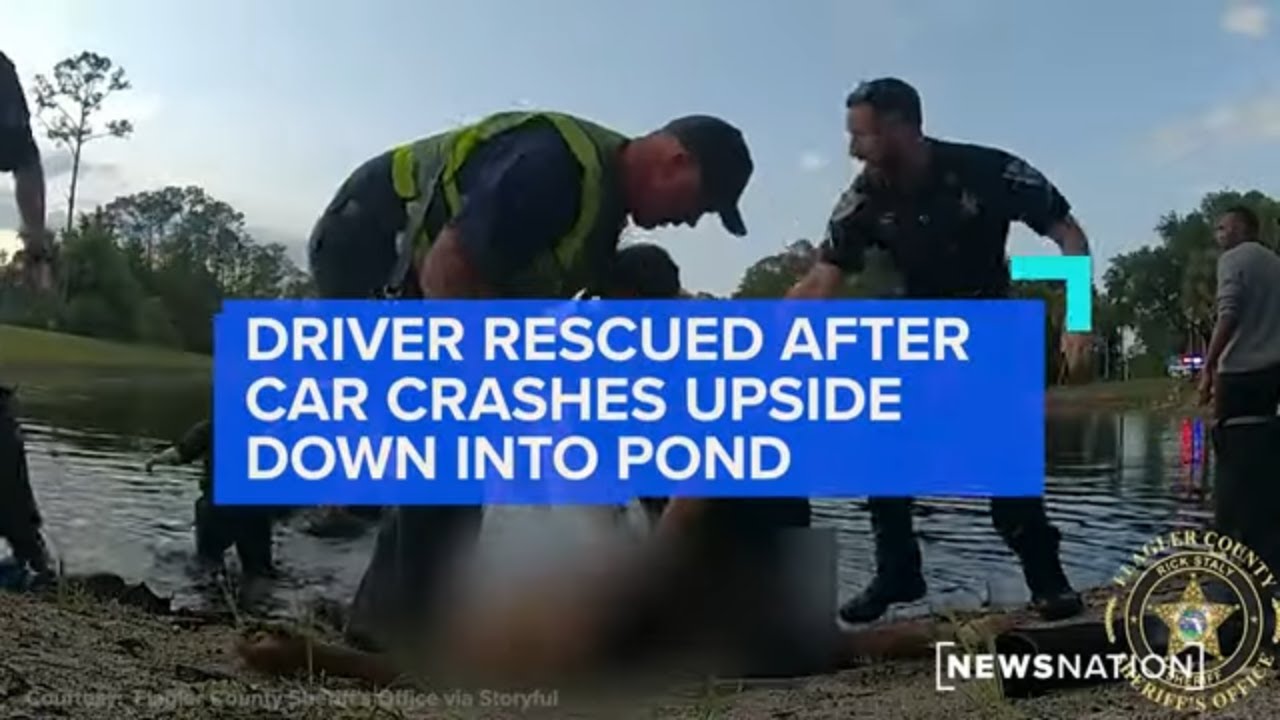 Driver rescued after car crashes upside down into pond | NewsNation ...