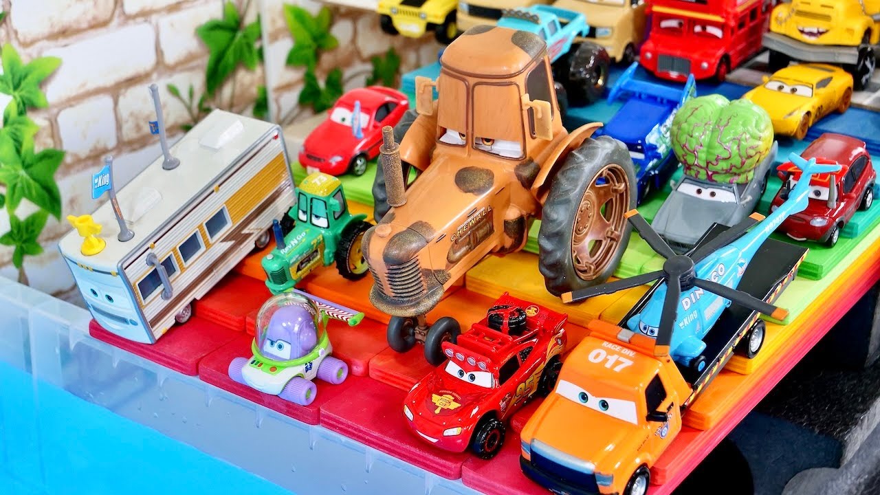 Disney Pixar Cars minicar falling  the water ! Running and rolling down a rainbow-colored hill.