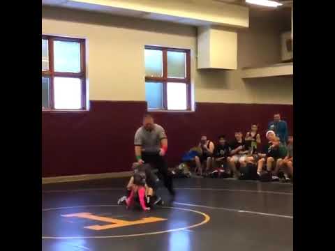 Brother protects sister during wrestling match