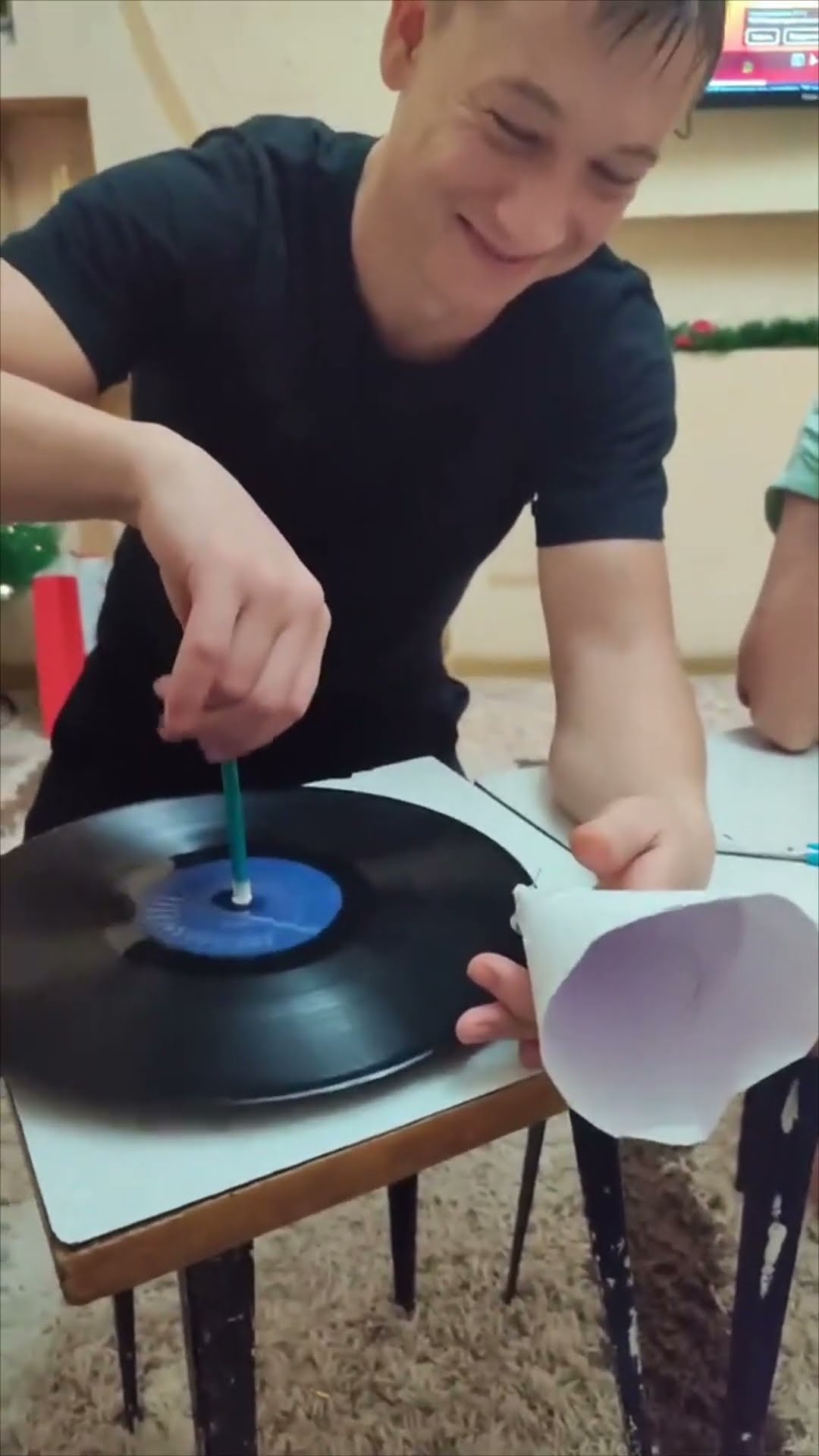 Man Uses Homemade Paper Cone Gramophone to Play Old Recording