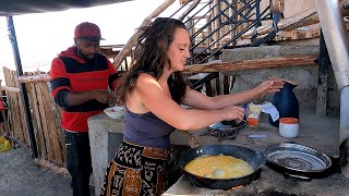 Canadian and African Husband Making Breakfast for Family in the Village