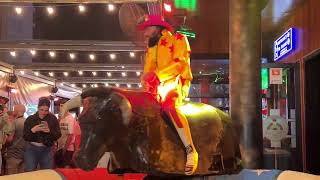 Men In Colored Clothes Riding On A Bull In Benidorm |  Bull Riding 4K