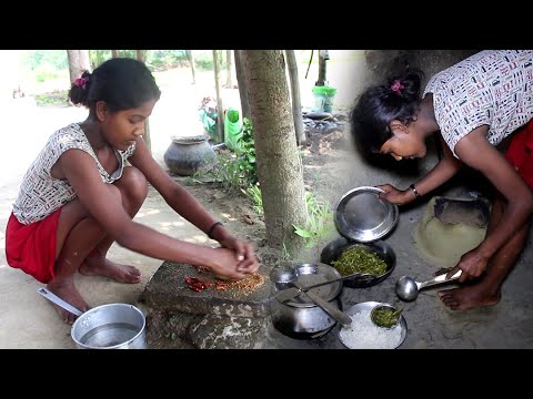 santhali tribe girl village cooking in traditional style of eating food  - rural lifestyle