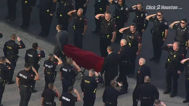 Body of slain Pct. 4 Deputy Kareem Atkins escorted...