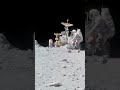 Astronaut Charles Duke working in front of the Lunar Roving Vehicle in Apollo 16 mission.