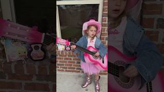 Little girl paying tribute to Dolly Parton with song