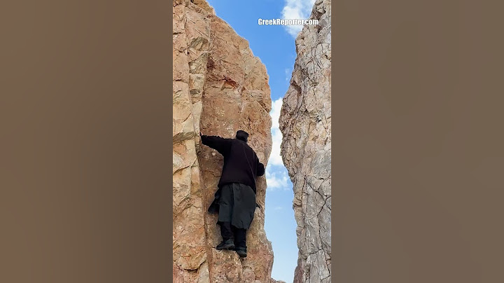 Monk climbing Mount Athos