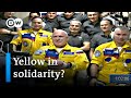 Russian cosmonauts board the ISS wearing blue and yellow suits | DW News