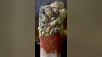 A matchstick igniting by the friction surface of the box.