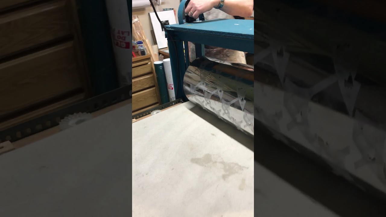 Printing with an intaglio etching press, a small etching plate. The press bed: 30 x 74”, 25” roller