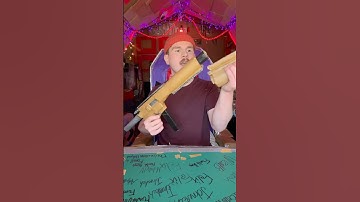 This cardboard SMG has a grenade launcher.