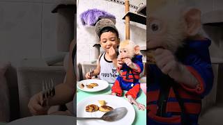 cute baby enjoy lunch with his pet