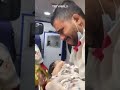 Palestinian paramedic consoles injured infant in ambulance