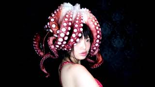 Naked Girl IN a A Bath With An Octopus On Her Head.