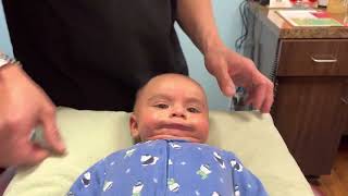 4 months old Baby getting chiropractic adjustment with Cranial and Sacral technique.