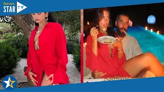Dua Lipa goes braless in risqué dress for rare snap with new beau