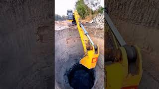 Well-digging process using heavy equipment.