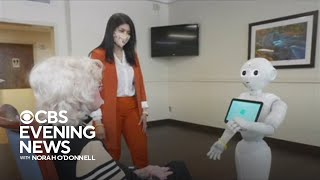 Nursing home uses robot to help patients with dementia