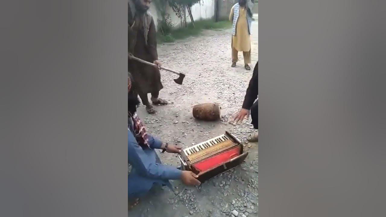 The Taliban smashing up musical instruments because they believe it’s