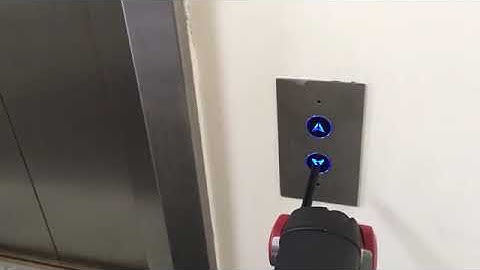 Robot DE NIRO pressing lift button autonomously