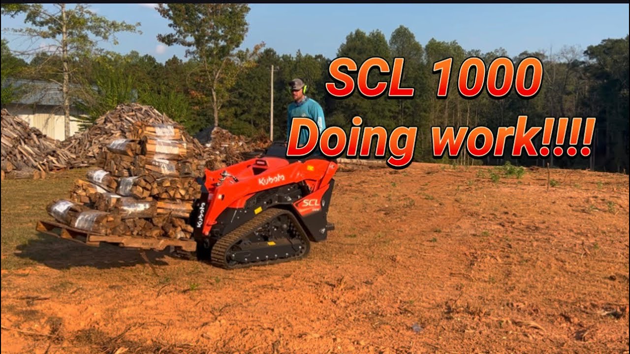 Kubota SCL 1000 making work easier! Using quick attach grapple plus pallet forks!