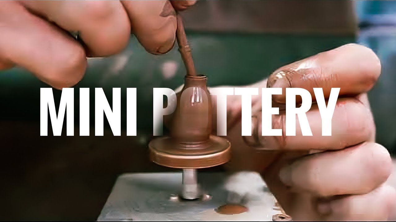 Throwing miniature pot on DIY pottery wheel. Satisfying video of making