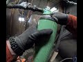 Using a ratchet strap and a couple wrenches to take off a filter housing 