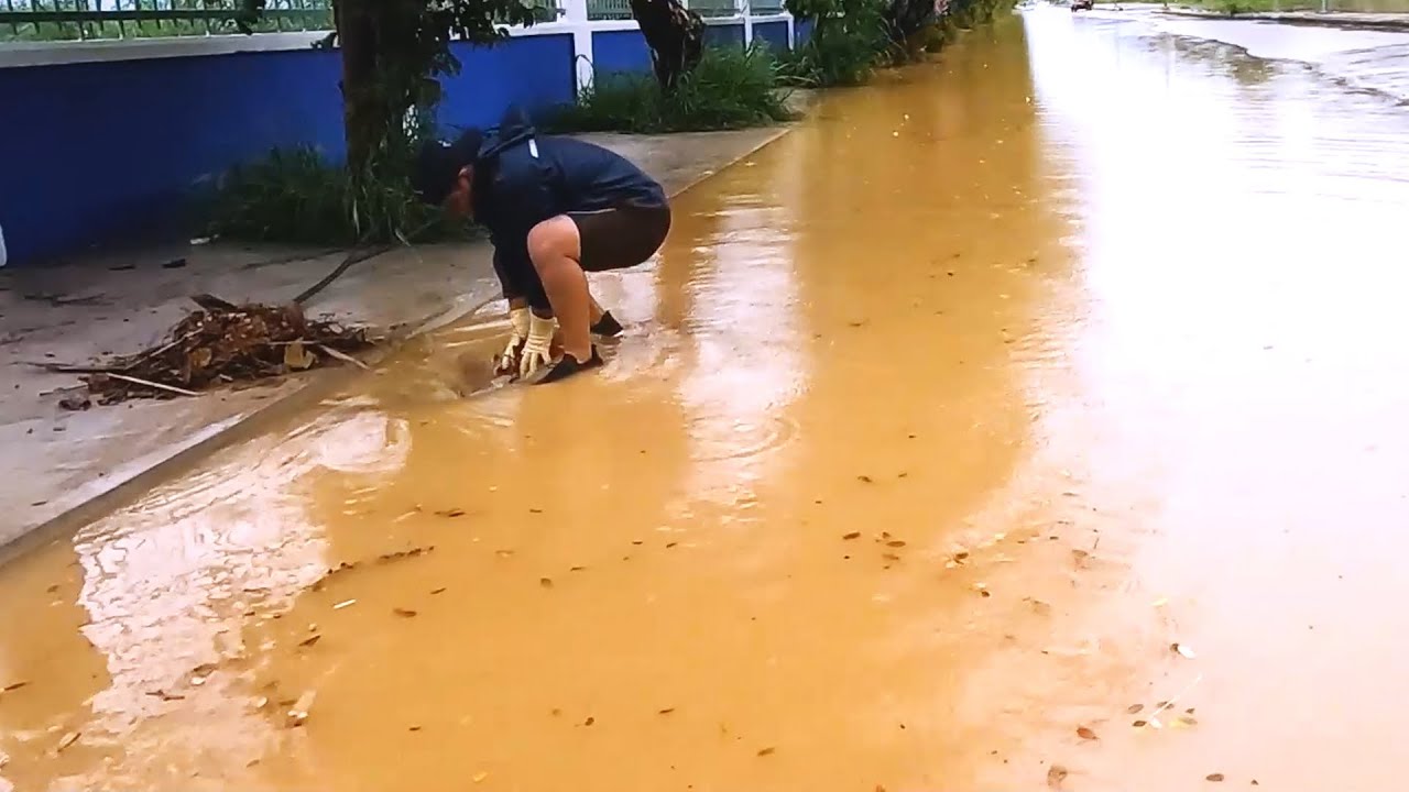 Heroes at Work Saving the Day by Unclogging a Storm Drain - YouTube