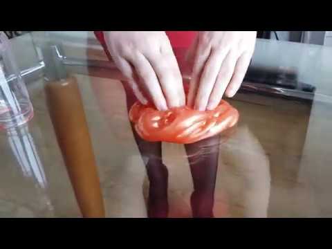 Funny girl playing and poking with slime