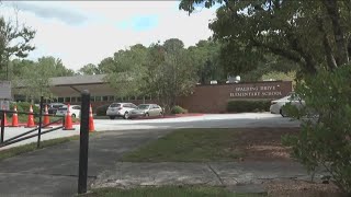 Board votes to continue school closure debate