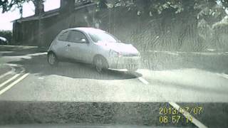 2013 07 07 woman in silver ka cutting corner badly unreadable number