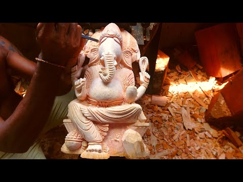 Hand carved wooden statue of Lord Ganesh made with real