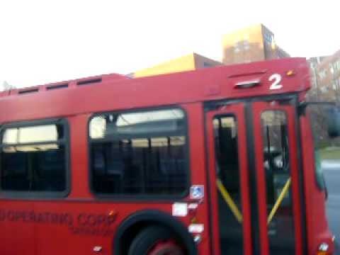 Here we are on Roosevelt Island, in front of The Octagon, which is one of the housing developments on the island. Here, we see a Q102, left to the charges of an Orion V CNG bus. We also see the bus I just stepped off of, which is the Red Bus. Red Bus has only 5 buses on the roster, 4 of them being Orion low floor hybrid electric buses, the other one being the one I just stepped off of, which is a 1994 New Flyer D40LF. If you have any questions about the video, feel free to message me. Comments are welcome. The video was taken on March 17th, 2009.