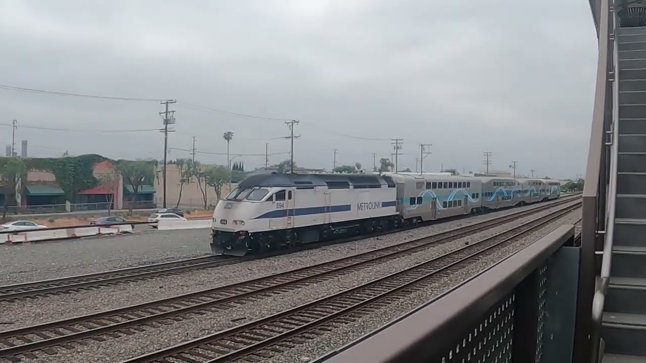 Metrolink 894 passes fullerton from parking structure