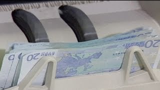 ECB holds interest rates, forecasts grim 2013
