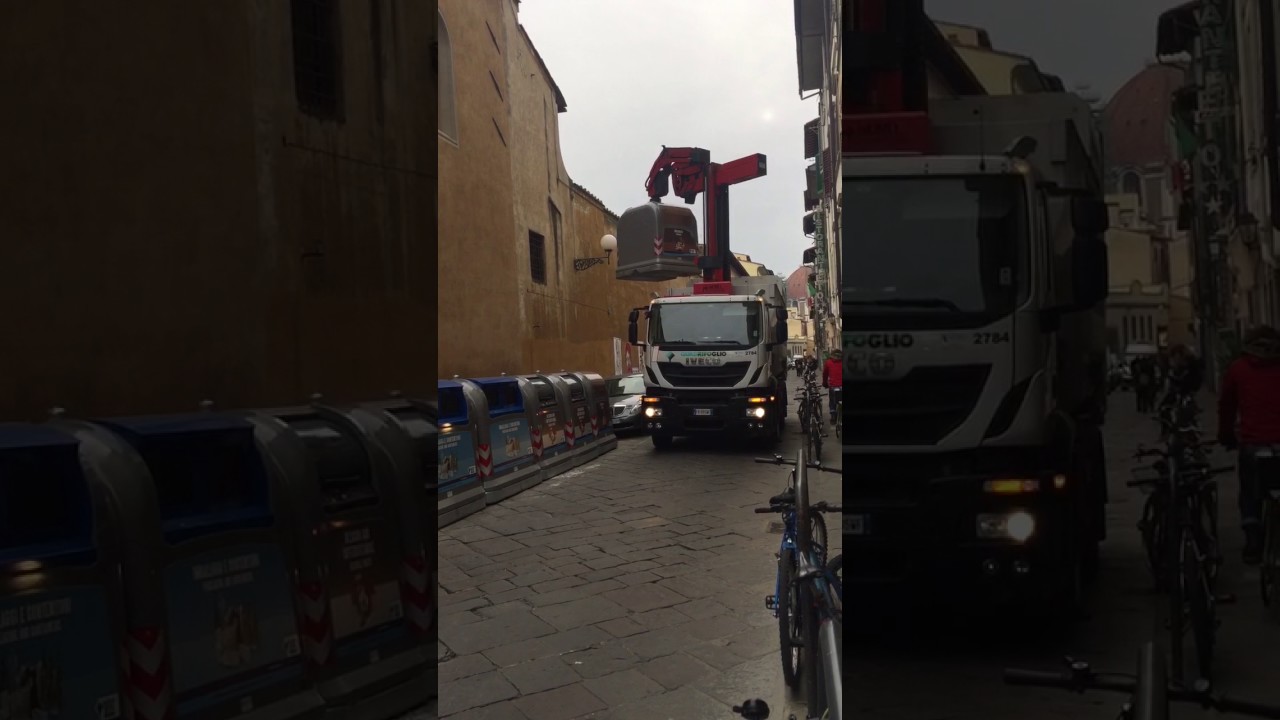 Side loader garbage trucks in Florence Italy