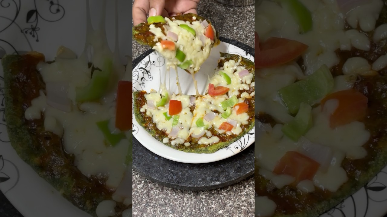 "Craving pizza? 🍕 Try this Healthy Palak Pizza made with fresh spinach, veggies & cheesy goodness!