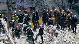 Rescuers suspend search ahead of Florida building demolition as storm looms