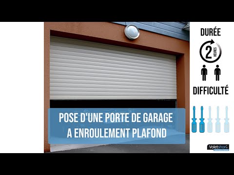 Pose d'une porte de garage à enroulement plafond.