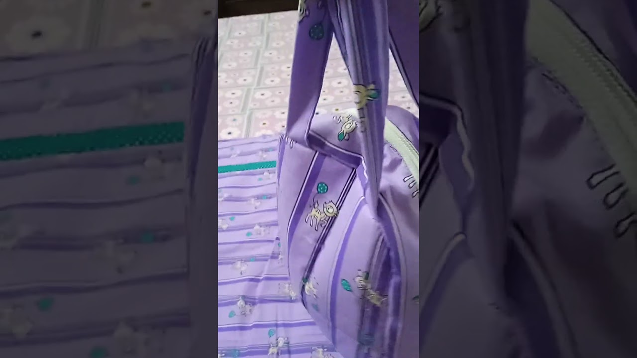 Baby sheet with pillow and small bag.