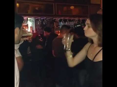 Girl downs beer in 3 seconds, the dude....lol