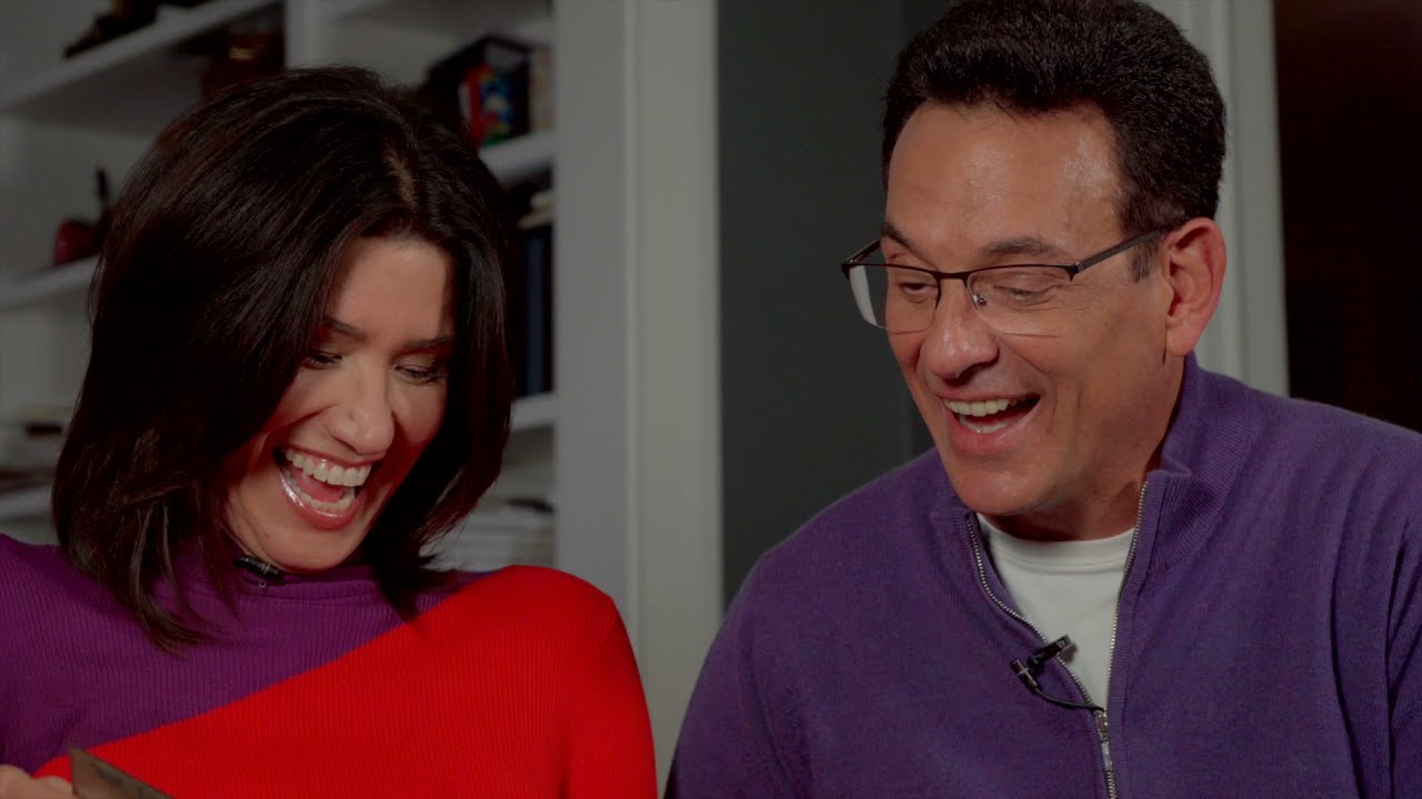 Empty Nesters Reminisce Over Family Photo Album - YouTube