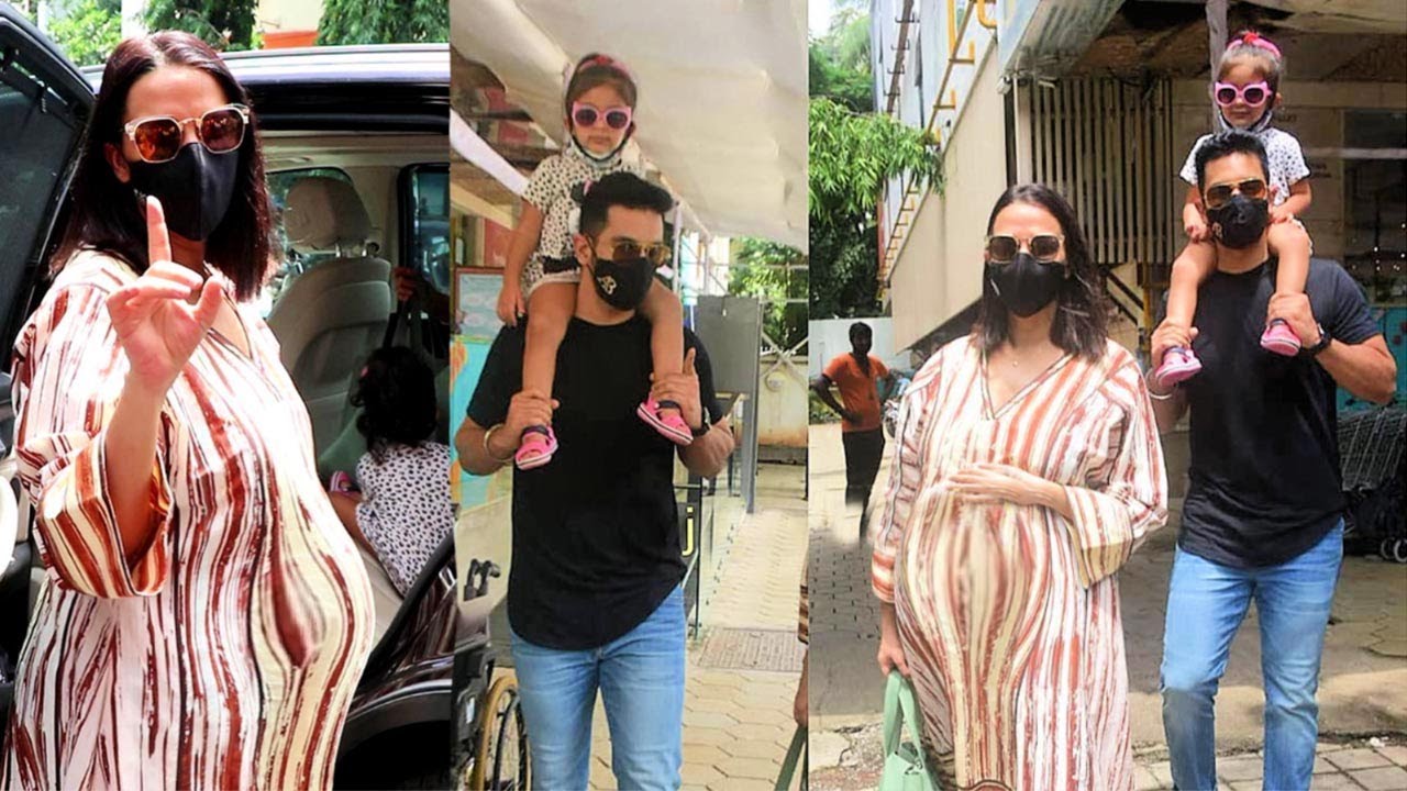 6 Month Pregnant Neha Dhupia Showing Her Growing Baby Bump To Media With Hubby And Daughter