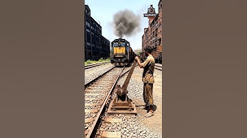 The duty of a male railway safety officer operating a manual track switch at a branching railway