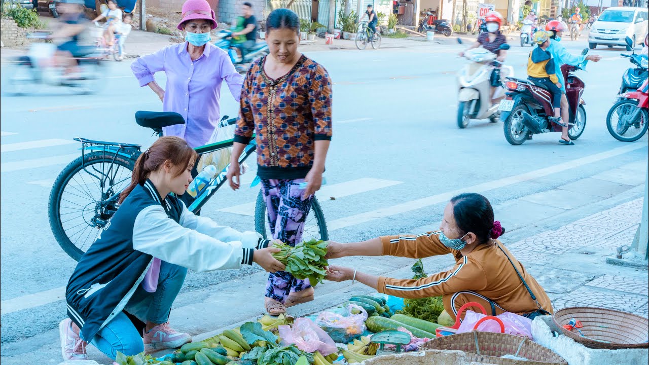 Girl picks vegetables in the garden and sells them at the street market Part 2